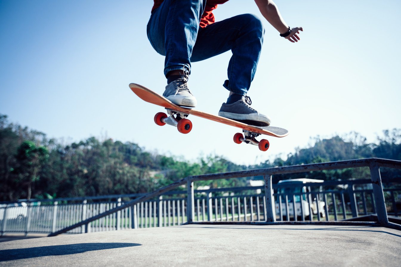 Skateboarder skateboarding at skatepark ramp